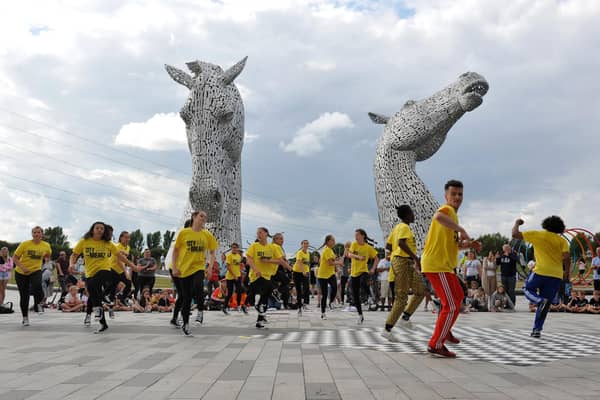 Room 2 Manoeuvre hip hop dancers throw down some shapes on the shadow of the Kelpies