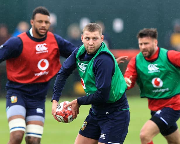 Finn Russell passes the ball during a recent British and Irish Lions training session (Photo by David Rogers/Getty Images)