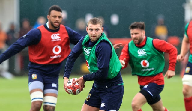 Finn Russell passes the ball during a recent British and Irish Lions training session (Photo by David Rogers/Getty Images)