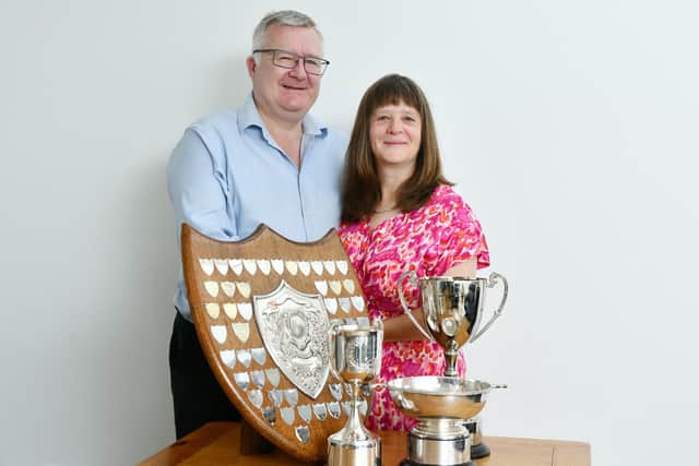 The couple, pictured with their recent trophies, have been dancing together for years and now run ballroom dance classes.  (Pic: Michael Gillen)