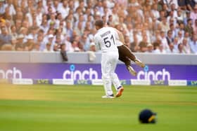 England's Johnny Bairstow carrying a Just Stop Oil protestor off the pitch  during day one of the second Ashes test match at Lord's, London. Adam Davy/PA Wire.