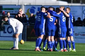 Cove celebrate the opening goal of the match (Pictures by Michael Gillen)