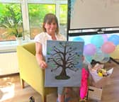 Marie Lavery with the finger painting she received from residents following her retirement (Picture: Submitted)