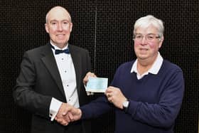 David Wheeler, chairman and president, of Falkirk Burns club, presents a cheque for £500 to Alastair Blackstock, chairman Falkirk Foodbank. Pic: Michael Gillen