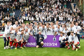 Falkirk FC's invincible League One champions pose with fans in the Kevin McAllister Stand