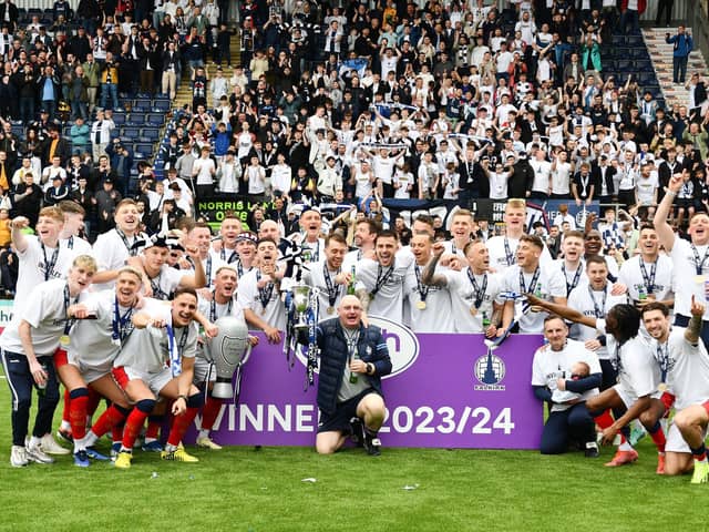 Falkirk FC's invincible League One champions pose with fans in the Kevin McAllister Stand