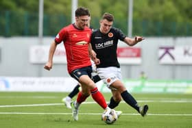 Falkirk's Michael McKenna and Stenny's Michael Anderson battle it out during the recent Premier Sports Cup meeting between the sides (Photo: Michael Gillen)