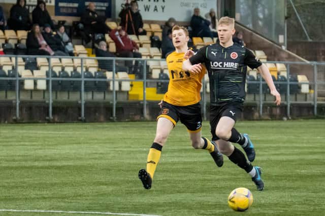Nicky Jamieson fends off Annan's Iain Anderson