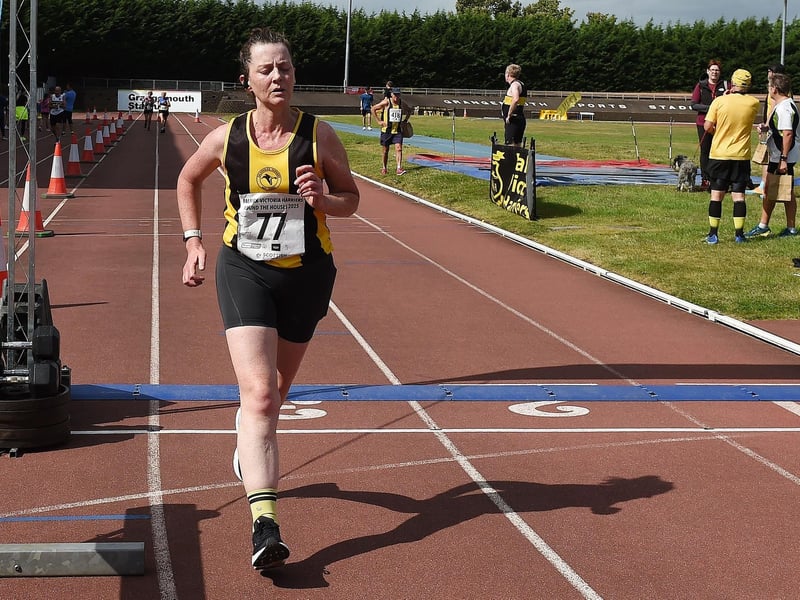 This runner appears to have entered some kind of zen state as she powers home across the finish line