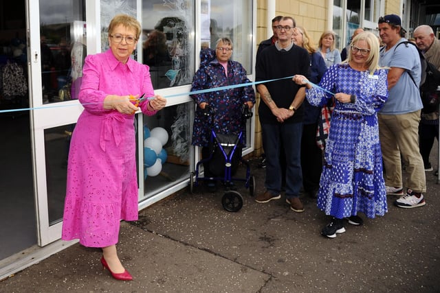 Strathcarron CEO Irene McKie cuts the ribbon to open the new store on Saturday.