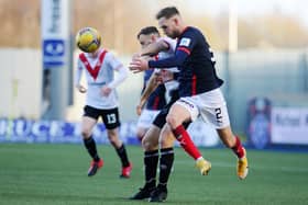 Scott Mercer challenges for the ball with Airdrie's Dale Carrick in Sunday's 1-0 defeat for the Bairns