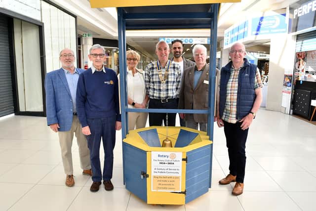 Club President David Wheeler with fellow Rotary members and the new wishing well in the Howgate.  (Pic: Michael Gillen)