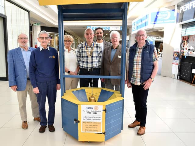 Club President David Wheeler with fellow Rotary members and the new wishing well in the Howgate.  (Pic: Michael Gillen)