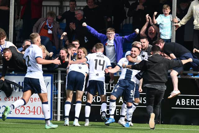 Jordan Allan and Bairns team-mates celebrate with travelling Falkirk fans after late leveller at Cove Rangers on Saturday (Pics by Michael Gillen)