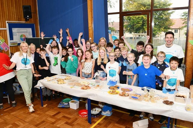 Pupils and staff from P7 delighted at their fundraising for Strathcarron.