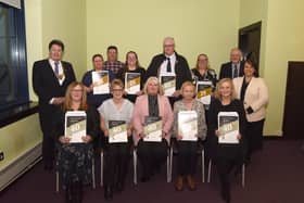 Provost Robert Bissett and Karen Algie with recipients of long service awards from transformation, community and corporate services.