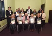 Provost Robert Bissett and Karen Algie with recipients of long service awards from transformation, community and corporate services.