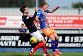 Steven Hetherington, left, in action against Queen's Park last Saturday (Pic by Michael Gillen)