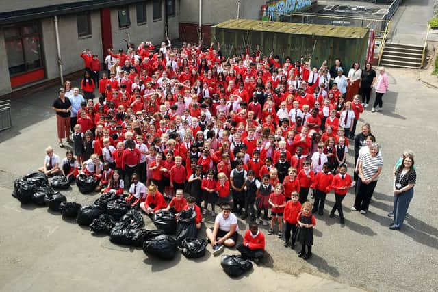 Pupils and staff at St Francis Xavier's Primary took part in a litter pick in the school grounds. Pic: Michael Gillen
