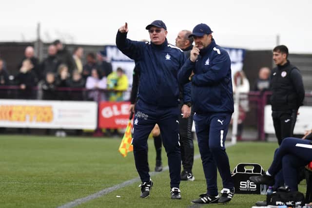 Falkirk management duo John McGlynn and Paul Smith on the touchline