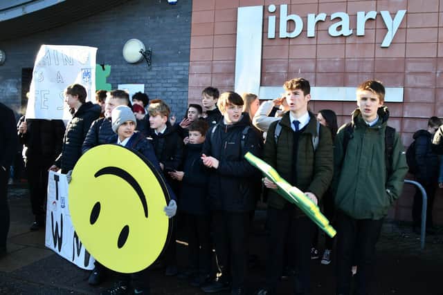 Pupils protest outside the consultation event in Larbert Library over proposals to close school swimming pools
