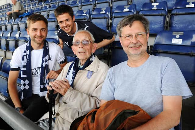 David Dalgleish pictured at a Falkirk FC game in August 2019 with grandsons Ewan and Gordon, and son Roy.