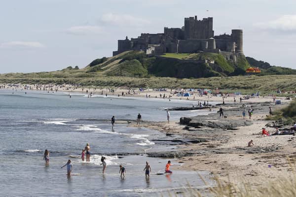 People enjoying the sunshine at Bamburgh Castle in Northumberland.
Pic: Owen Humphreys