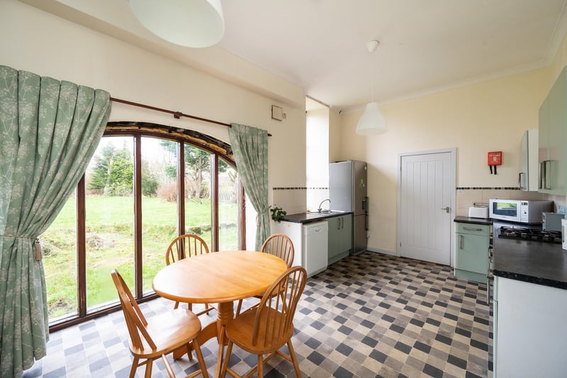 The farmhouse kitchen offers a bright and spacious room for a family to congregate