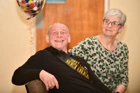 Iain Aitchison with wife Alison enjoys the leaving ceremony on his last day at the primary school he has worked at for 21 years(Picture: Michael Gillen, National World)