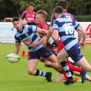 Connor Faulds aims his pass to a team-mate under pressure (Pics by Gordon Honeyman)