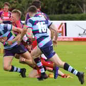 Connor Faulds aims his pass to a team-mate under pressure (Pics by Gordon Honeyman)