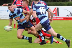 Connor Faulds aims his pass to a team-mate under pressure (Pics by Gordon Honeyman)