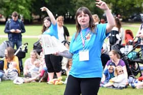 Librarian Debbie Scott bringing books to life at an outside Bookbug event