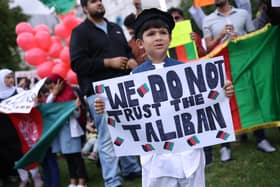 Protesters gather on Parliament Square to protest against the Taliban take over of Afghanistan (Photo by Dan Kitwood/Getty Images)