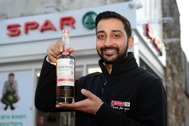 Anand Cheema, owner of SPAR in Maggie Wood's Loan, Falkirk, which is stocking a rare £1600 Rosebank Lowland Single Malt Scotch Whisky. Picture: Michael Gillen.