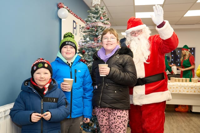 Youngsters meet the great man himself in the cosy confines of the Pacitti Jones Christmas grotto