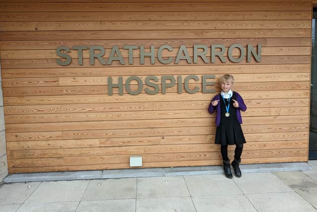 Roslynn Gray at Strathcarron Hospice after handing over the money raised from her cake sale