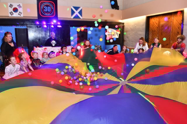 Youngsters enjoyed some parachute games.