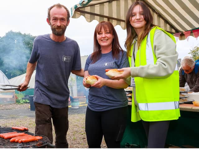 Steve, Danielle and Kimberley from STS get the barbecue going. (Pics: Scott Louden)