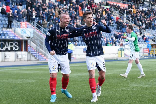 Goalscorer Leigh Griffiths celebrates his first goal for the club with teammate Charlie Telfer (Picture: Ian Sneddon)