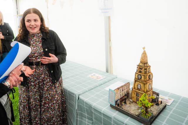 Chloe Edwards and her cake depicting the Steeple and surrounding buildings which she entered in the Great Falkirk Bake Off in May
