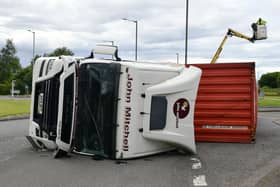 The lorry over turned on the A904 Timber Basin Roundabout in Grangemouth
(Picture: Michael Gillen, National World)