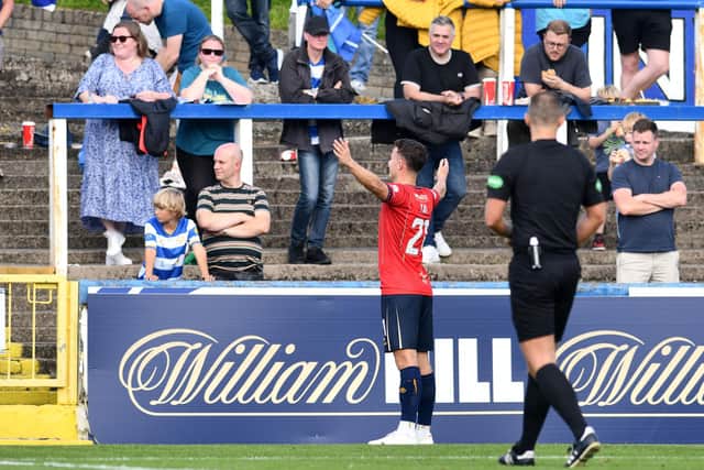 Dylan Tait makes his feelings known to the home support after scoring (Photo: Michael Gillen)