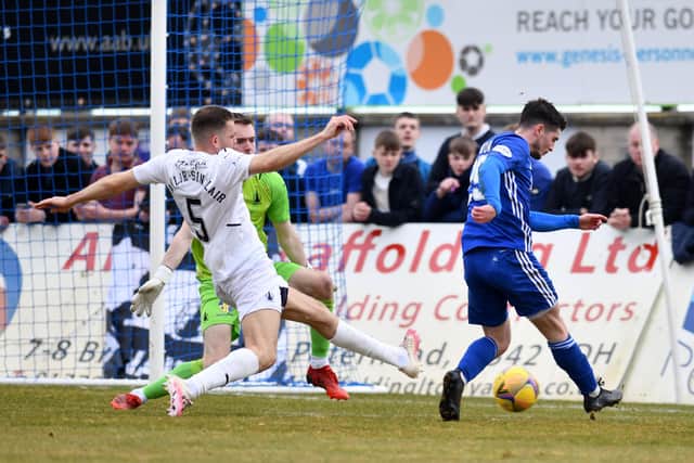 Brown smashes the ball past Mutch to give Peterhead the lead (Pictures: Michael Gillen)