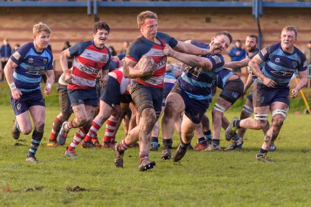 Captain Harry Russell (far left) joins his teammates in attempting to win the ball back (Picture: