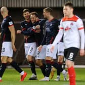 Falkirk players celebrate after Scott Mercer had put them 2-0 up at Clyde (Pic by Michael Gillen)