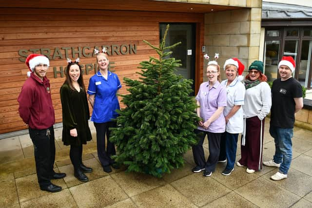 Strathcarron Hospice will be joined by Torwood Garden Centre and Sustainable Thinking Scotland CIC to run a Christmas tree collection fundraiser. Pictured with staff from Strathcarron are Jamie Stevenson, Torwood Garden Centre and Sean Kerr, Sustainable Thinking Scotland CIC Bo'ness. Pic: Michael Gillen