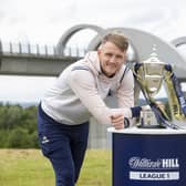 Falkirk captain Coll Donaldson poses with the League One trophy at the Falkirk Wheel ahead of tomorrow night’s William Hill Championship opener against Queen’s Park (Photo: Submitted)