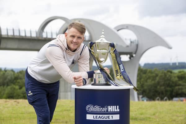 Falkirk captain Coll Donaldson poses with the League One trophy at the Falkirk Wheel ahead of tomorrow night’s William Hill Championship opener against Queen’s Park (Photo: Submitted)