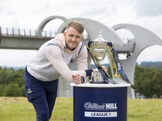 Falkirk captain Coll Donaldson poses with the League One trophy at the Falkirk Wheel ahead of tomorrow night’s William Hill Championship opener against Queen’s Park (Photo: Submitted)